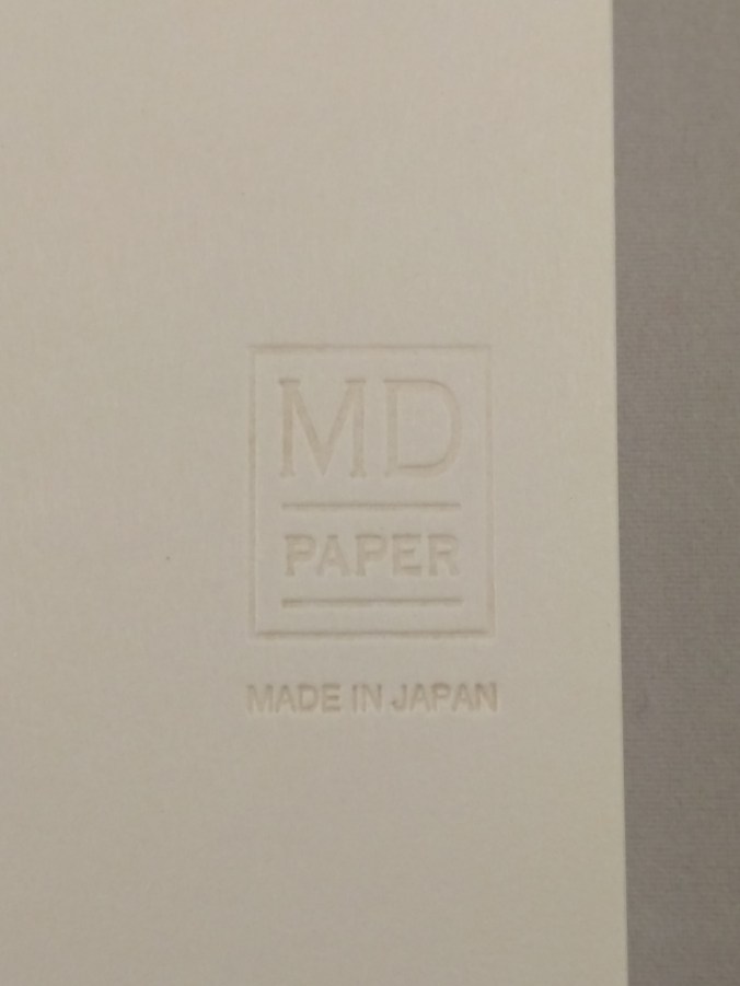 Embossed Midori MD logo